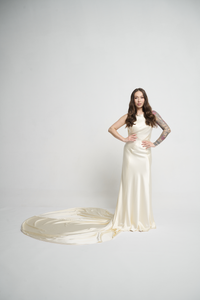 A bias silk crepe back satin gown, with a Cowl Cap from shoulder to Waist.