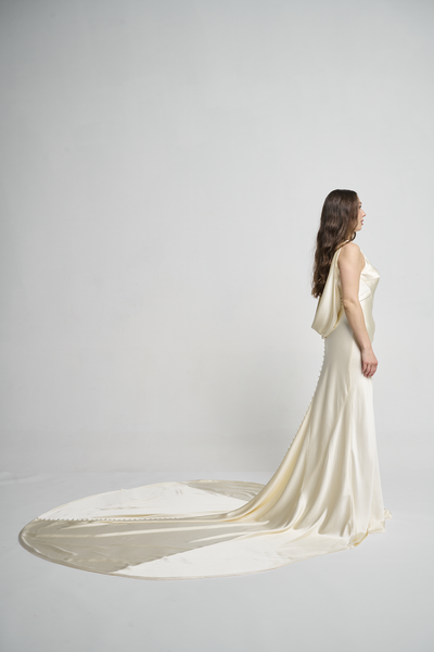 A bias silk crepe back satin gown, with a Cowl Cap from shoulder to Waist.