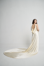 A bias silk crepe back satin gown, with a Cowl Cap from shoulder to Waist.