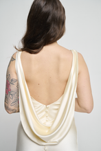 A bias silk crepe back satin gown, with a Cowl Cap from shoulder to Waist.