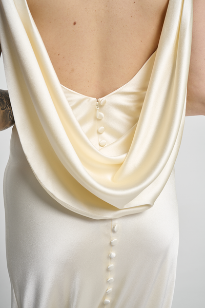 A bias silk crepe back satin gown, with a Cowl Cap from shoulder to Waist.