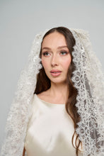 A Cathedral Length Corded Couture Lace Veil.