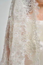 A Cathedral Length Corded Couture Lace Veil.